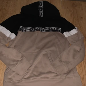 Hoodie  - Beige, black and white hoodie. Size EUR 158/164. Worn about 6 times and in good condition. Not super thick so good for spring. 