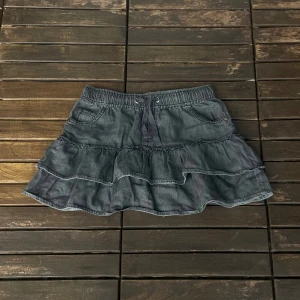 Kort jeanskjol - Uppskattad storlek 