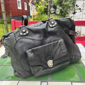 Leather bag  - Real leather bag. Lining has a few stains. 