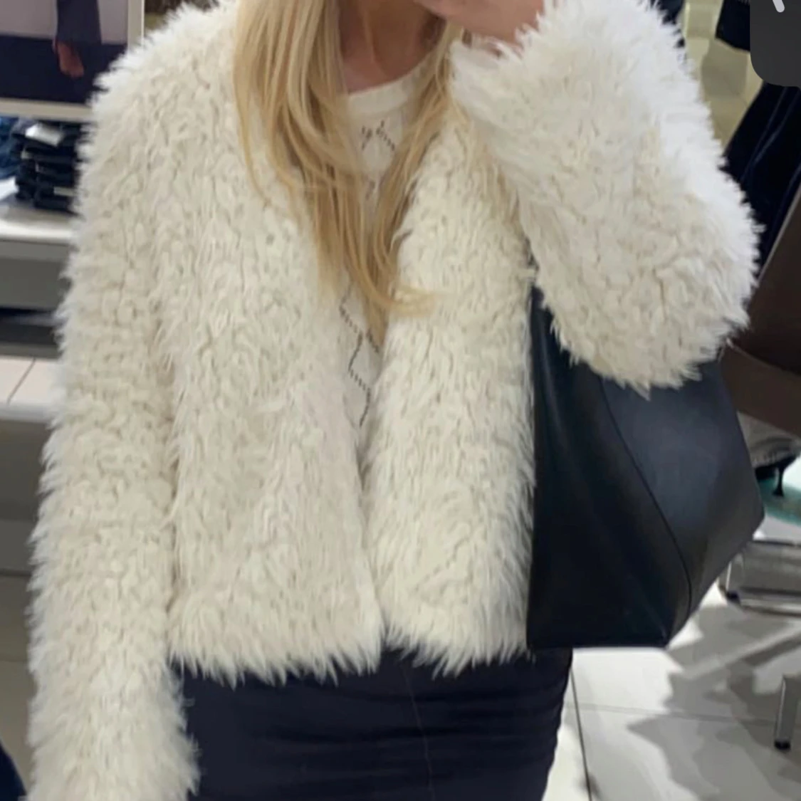 Vit pälsjacka