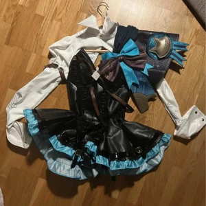 Lynette cosplay+ wig  - The wig is from Dokidoki and the costume is from Uwowo. The cosplay is a short on the back!!! The wig has been cut weird from the previous owner. The wig is a bit styled! And I don't have ears or socks to go with the cosplay.