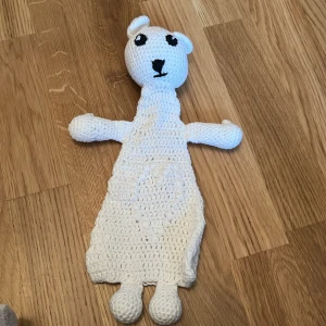 snutte - Vit snutte med bjällra i 