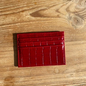 Vinröd korthållare - 7 st fack, aldrig använd. Super fin vinröd färg