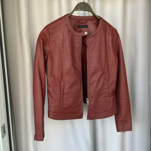 Red jacket with zip and button   Disclaimer: not real leather