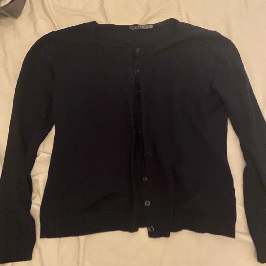 Mörkblå kofta från Fiore