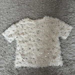 Topp - Glittrig beige fjäder topp , passar XS