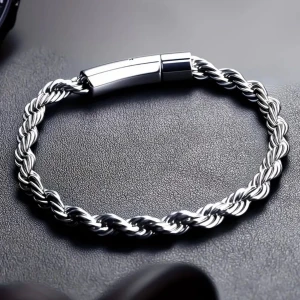 Flätat silverfärgat armband - Snyggt armband i silverfärgad metall med flätad design och stilren magnetlås. Perfekt för dig som gillar minimalistiska och moderna accessoarer. Passar både till jeans och skjorta för en cool vibe.
