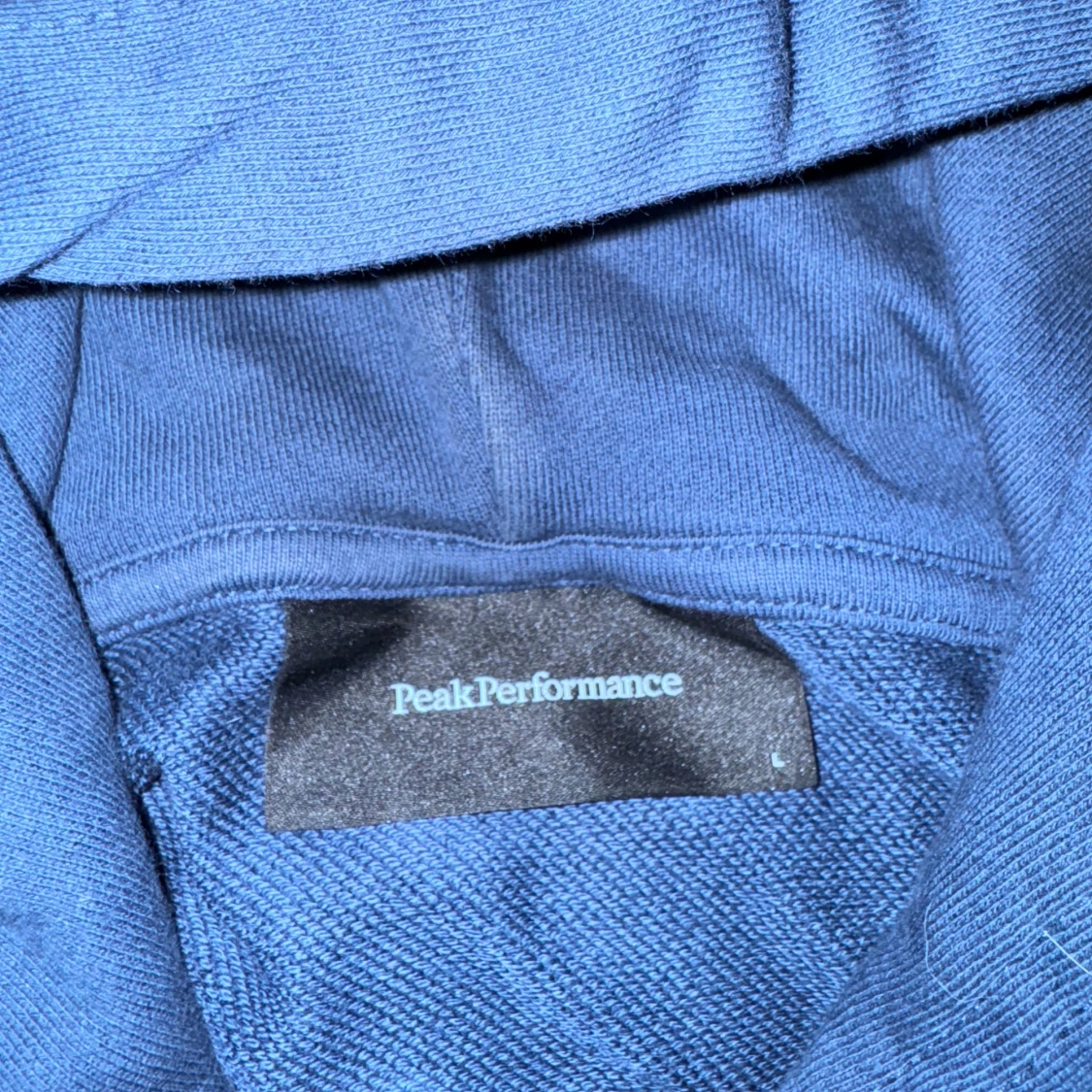 Blå hoodie från Peak Performance - 1