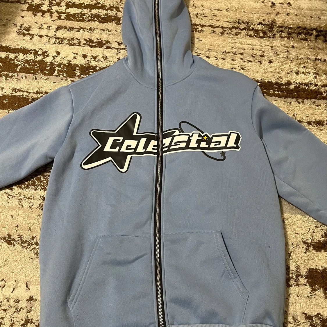 Blå hoodie med Celestial-tryck - 1