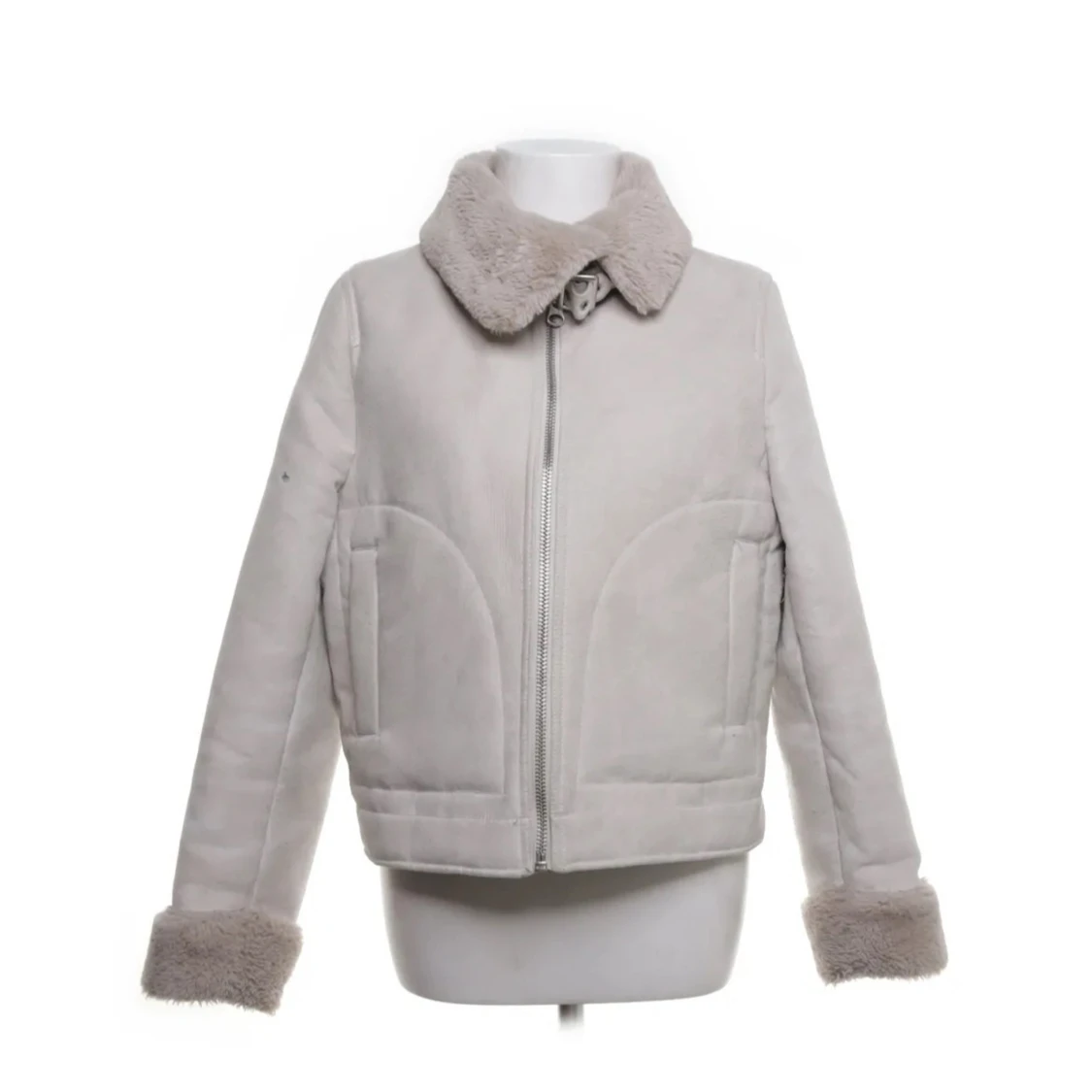 Ljusbeige jacka med fuskpälsdetaljer