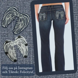 Mörkblå jeans med vingbroderi - Snygga mörkblå jeans med unikt vingbroderi på bakfickorna. 