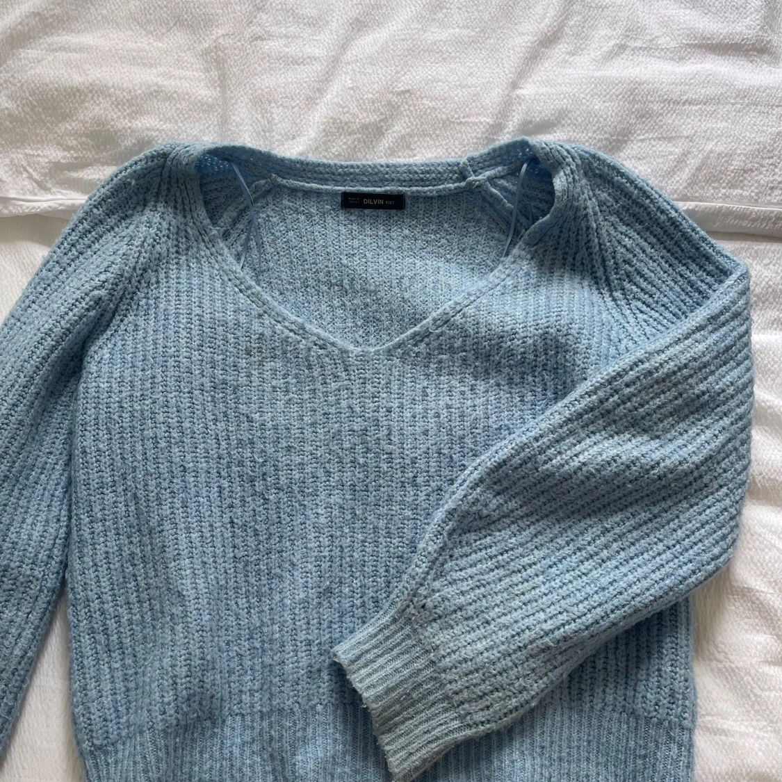 Ljusblå stickad tröja från Dilvin