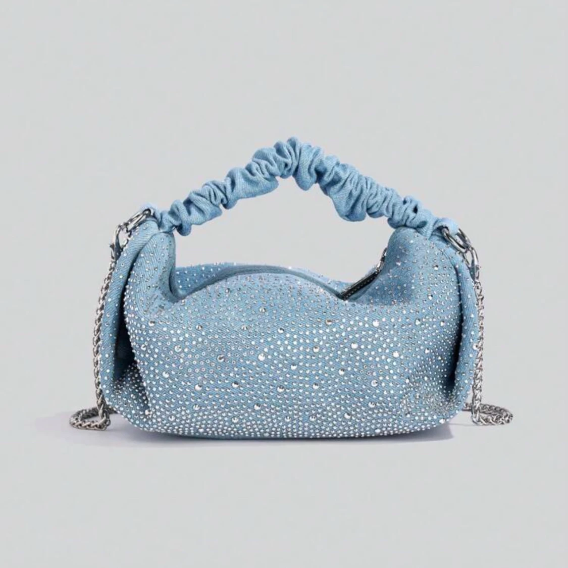 Blå glittrig väska