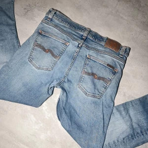 Nudie jeans - Nudie jeans | Modell Thin Fin | Bra skick | Storlek W32 L32. 