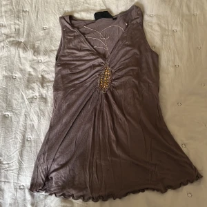 Topp från st-Martins  - Säljer en brunt linne i storlek M 