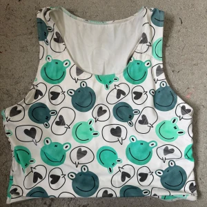 Binder wivov  - Kort wivov binder med grodor. Storlek L men något uttöjd så skulle säkert passa något större. Se storleksguide på bild tre 