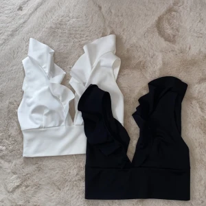 Svart och vit volangtopp - Två fina volangtoppar för endast 100 sek