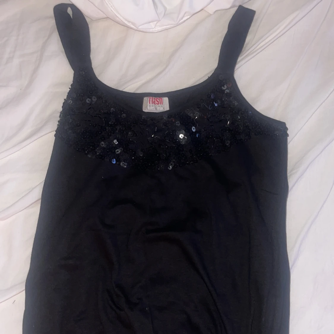 Svart paljettlinne från Flash