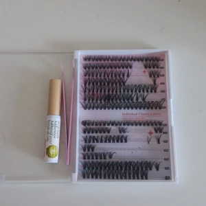 Individuella lösögonfransar & lim - Säljer ett kit med svarta individuella cluster lashes i olika längder (9-16mm), ett genomskinligt franslim med aloe vera och ett rosa appliceringsverktyg. Perfekt för att skapa en personlig franslook med naturlig eller dramatisk effekt. 