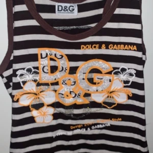 Ett randigt Dolce and Gabbana linne  - Ett brunt Dolce and Gabbana linne som är köpt ganska längesen men kommer inte till mycket användning