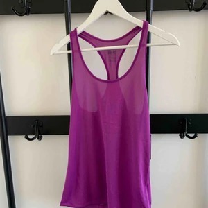  - Nike Dry Fit tank top Brand: Nike Size: S Colour: Purple  Never worn. Still has tag. 2 years old.