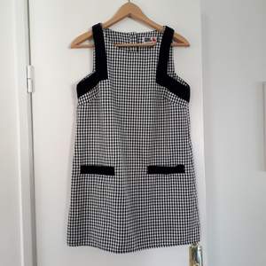 This is a 60's style check dress from River Island, Chelsea Girl. It is bought second hand, in good condition. I'm selling because it's too small for me. I would say it's pretty true to size.