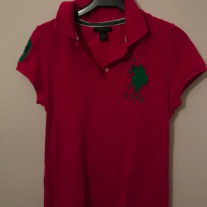  - Piké i rosa färg storlek large 