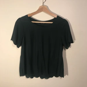  - Dark green scalloped blouse from TopShop