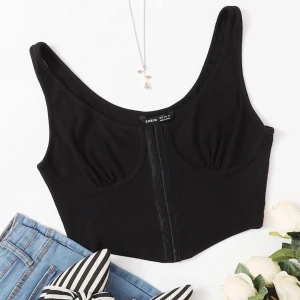 Corset liknande topp - Corset liknande topp med bh-spännen på framsidan! endast testad, frakt ingår