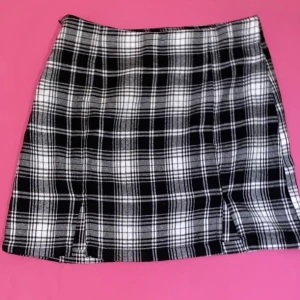 Shirt  - This skirt is from SHEIN. NEVER BEEN WORN. A size Xs but it runs big 