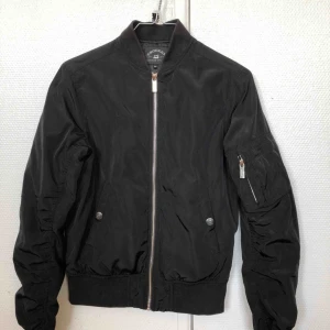  - 3 years old, small form fitting bomber jacket, worn maybe 10 times, okay condition. 
