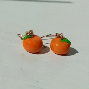 orange handmade earrings 🍊 - handmade earrings made by me 🍊👁️👄👁️.                                        charm size : 1 cm