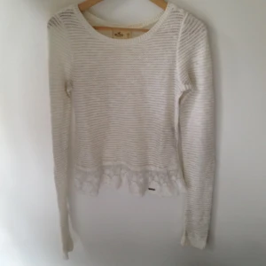  - Hollister, white sweater with lace  Small makeup stain at collar and at sleeve 