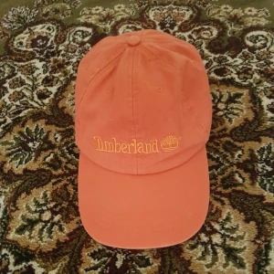 - Orange keps Timberland. Köparen står för frakt 50kr ⚘
