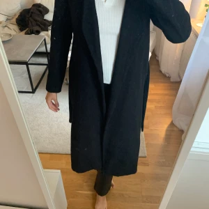 Lång kappa - En lång kappa från nakd! 