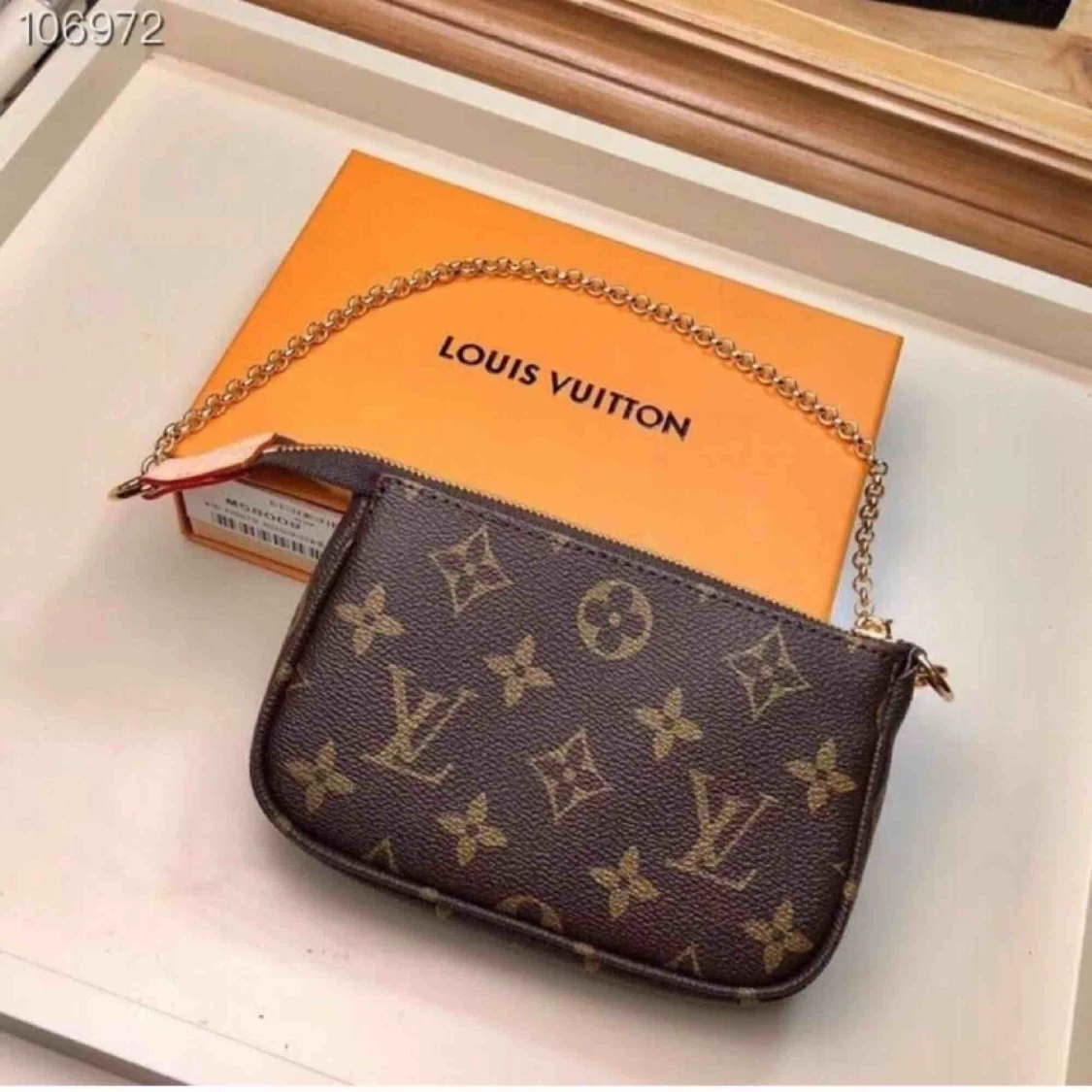 Louis Vuitton Mini Pochette - 90