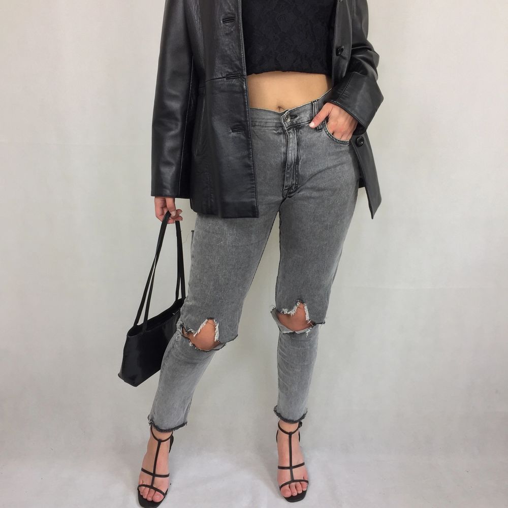 These badass high waisted thin jeans are from Tiger Of Sweden. In great condition! Handmade holes and ruffles at the bottom. Model use S for reference. No return nor refund. Free shipping. Waist 36cm Length (from the waist and down) 91cm. Jeans & Byxor.