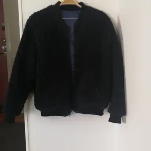 Two sided bomber jacket. Bluesatin and black wool lining. Small size. Sleeves 57cm, body 64 cm long