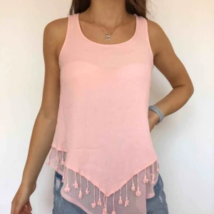  - Sött orange/rosa linne. Säljer på grund av att jag knappt använder det. Frakt ingår i priset