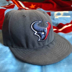  - Was in my car. Never worn. Lost some color on the top due to sun.