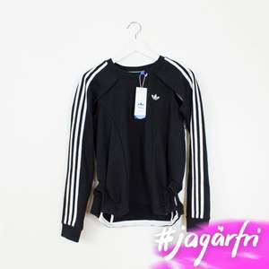 Adidas Couture crew med justa cutouts under armarna. Helt ny med tags. Fet.