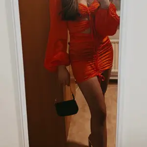 Satin orange dress with cuts 