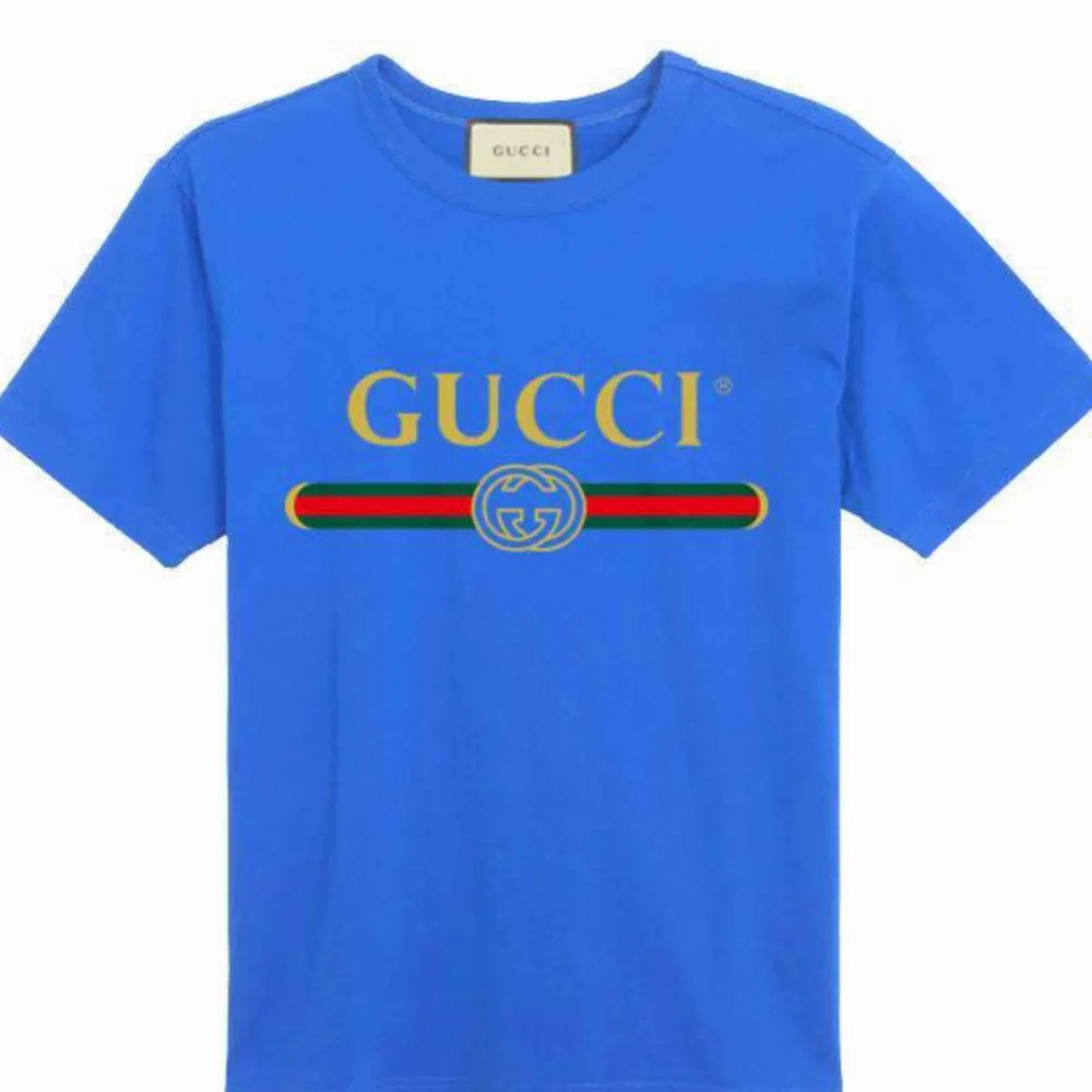 Gucci   Fabric:100 Percent Cotton   Color: blue   Sleeve:Half Sleeve   Pattern:Printed   Neck Shape:Round   Fit:Regular Fit. T-shirts.