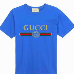 Gucci   Fabric:100 Percent Cotton   Color: blue   Sleeve:Half Sleeve   Pattern:Printed   Neck Shape:Round   Fit:Regular Fit