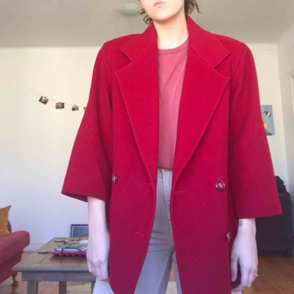 perfect condition! beautiful red and buttons so unique, marble red. bought at a vintage store and have only worn once! plus SICK SHOULDER PADS!. Jackor.