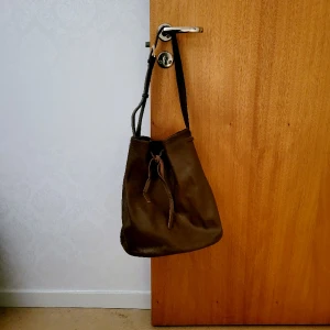 Genuine leather bucket bag - Bought from Singapore a couple years ago.  Refer to the second photo for the actual shade of brown.  it's about 17cm x 29cm x 35cm.  DM for questions or more photos.