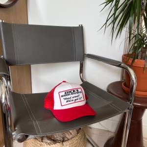 a trucker hat that will make people look. a really funny and cool trucker hat. worn but no signs of wear