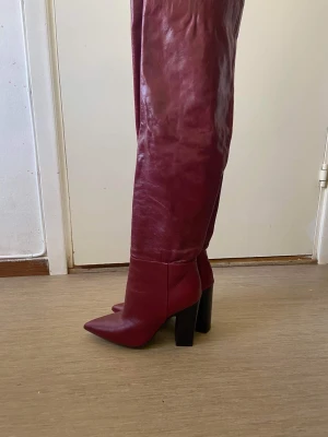 Zara Burgundy leather boots - Zara Burgundy leather boots. worn once. good condition. price was 2000 sek but selling for 1000sek