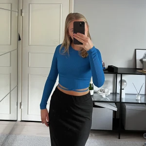 Festtopp - Blå Festtopp med knytning i väldigt bra skick.