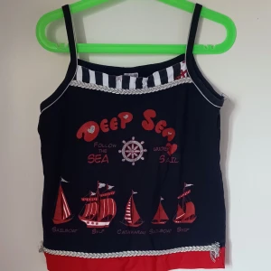 Linne. Tank top  - True to size. A 90s style tank top if you can style it!. 